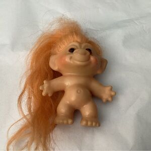 Troll, D.A.M. 2 1/2” T Amber colored eyes and Orange color hair. 1980’s